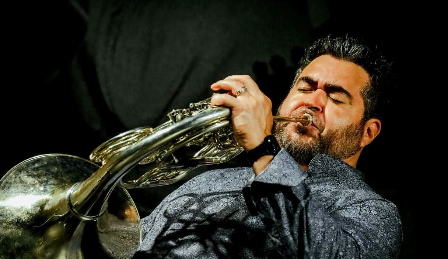 Chris Castellanos performing on French horn