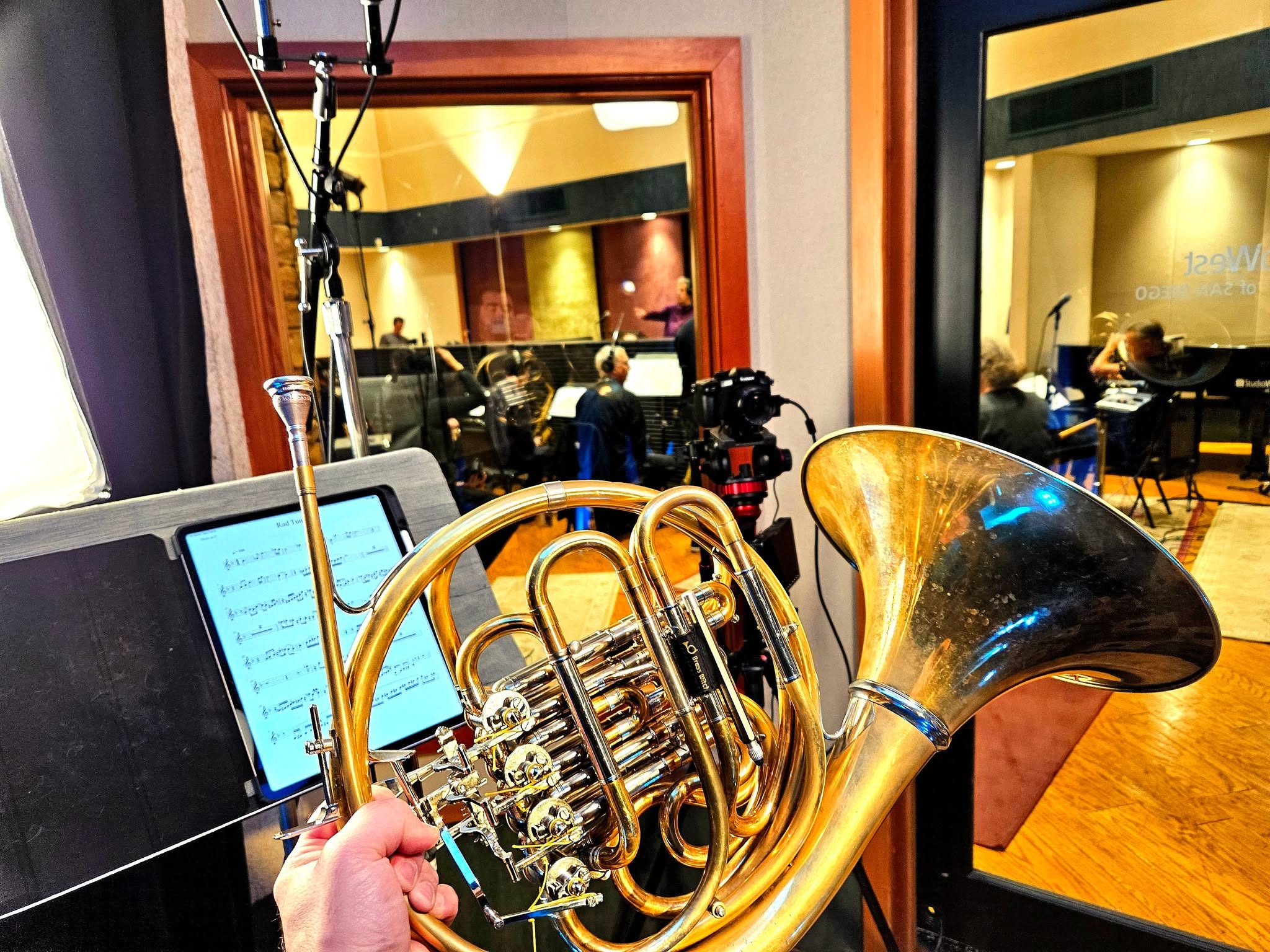 Chris Castellanos holding his horn during a recording session